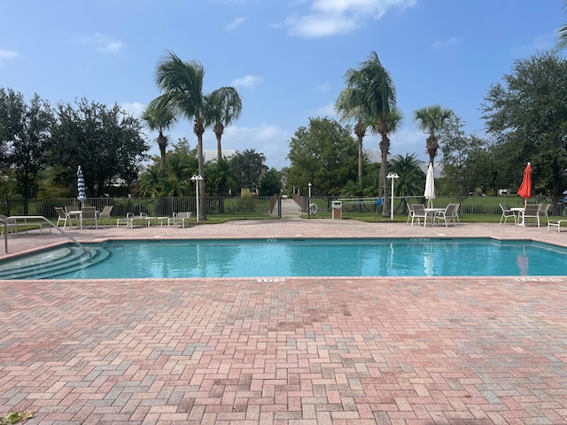 view of swimming pool with a patio area