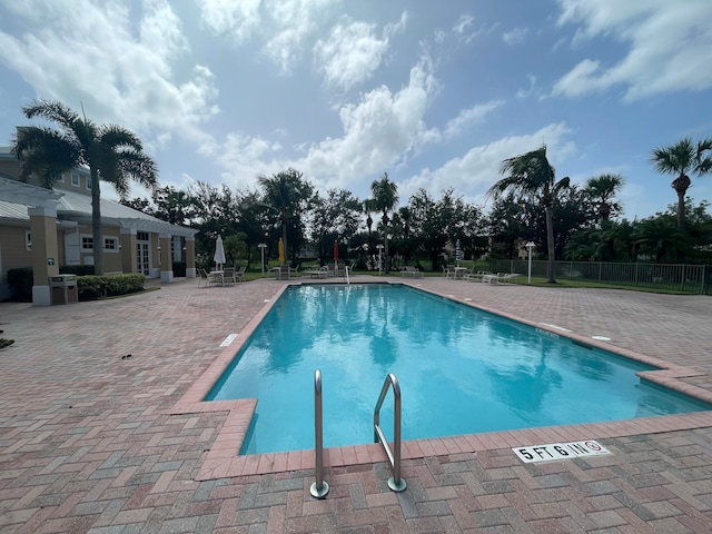 view of pool with central AC and a patio area