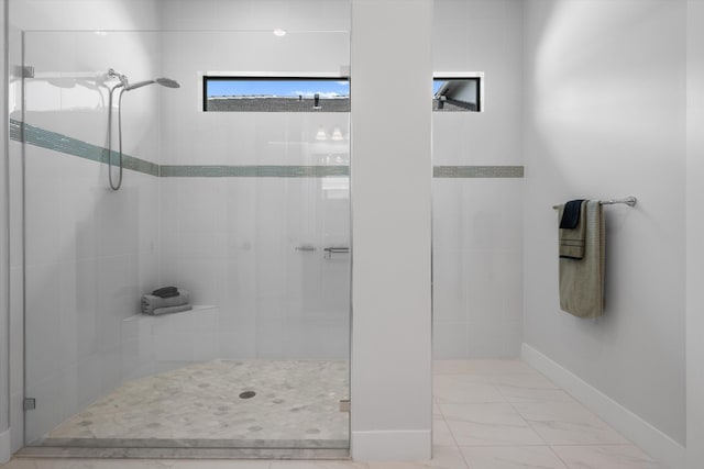 bathroom with a shower with shower door