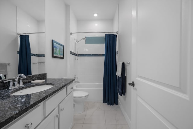 full bathroom featuring shower / bath combination with curtain, vanity, and toilet