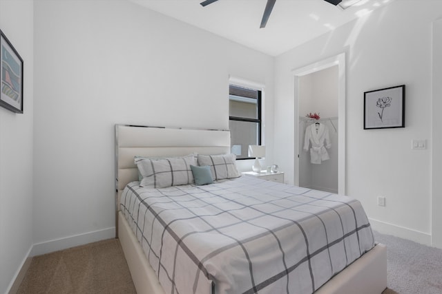 bedroom featuring ceiling fan and light colored carpet