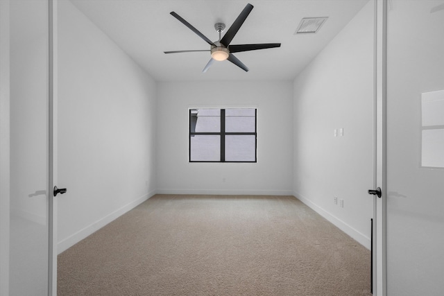 empty room with carpet flooring and ceiling fan