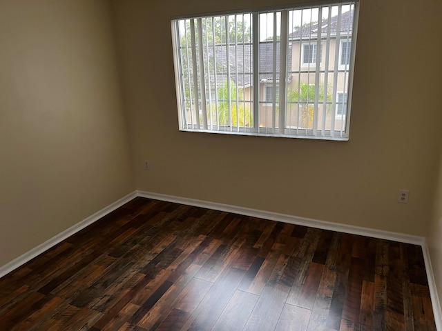 empty room featuring dark hardwood / wood-style floors