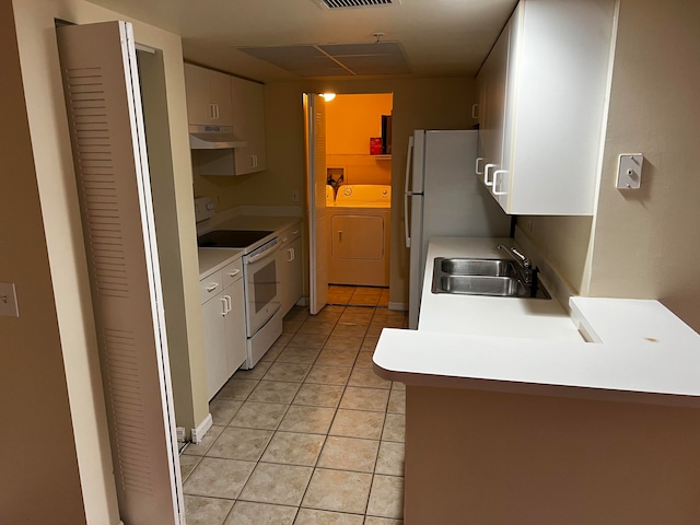 kitchen with electric range, sink, white cabinets, independent washer and dryer, and light tile patterned floors