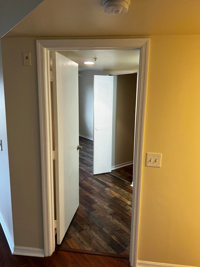 corridor featuring dark hardwood / wood-style floors