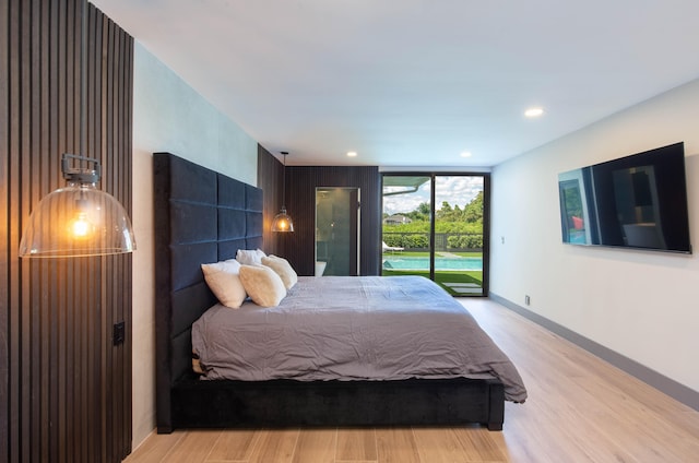 bedroom featuring access to outside and light wood-type flooring