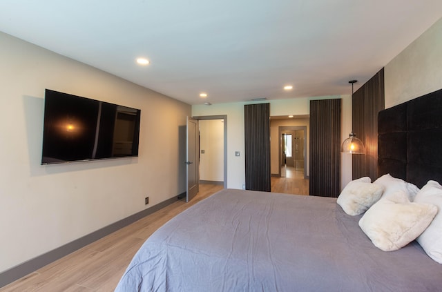 bedroom featuring light hardwood / wood-style floors