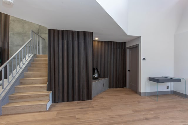 staircase with hardwood / wood-style flooring