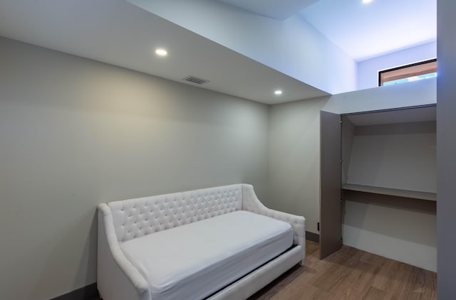 living area with hardwood / wood-style flooring