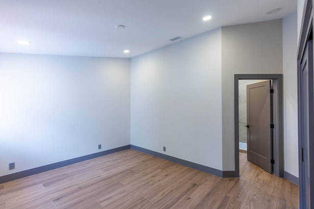 spare room with light hardwood / wood-style flooring