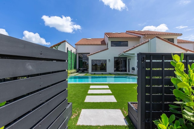 view of pool featuring a yard