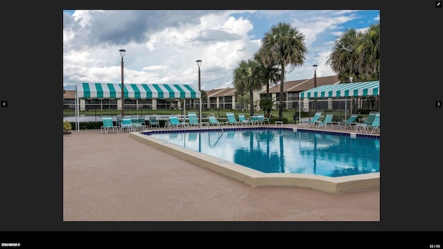 view of pool featuring a patio area