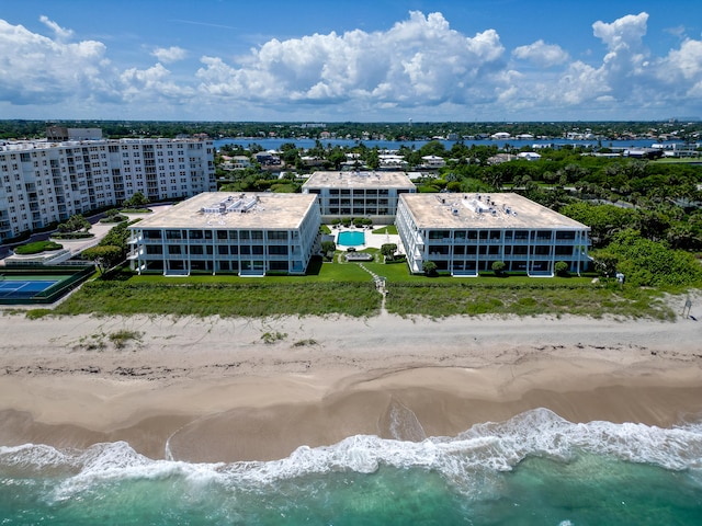 bird's eye view featuring a view of the beach and a water view