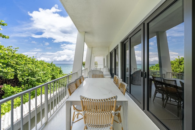 balcony featuring a water view