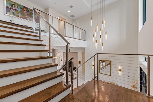 stairs with wood-type flooring