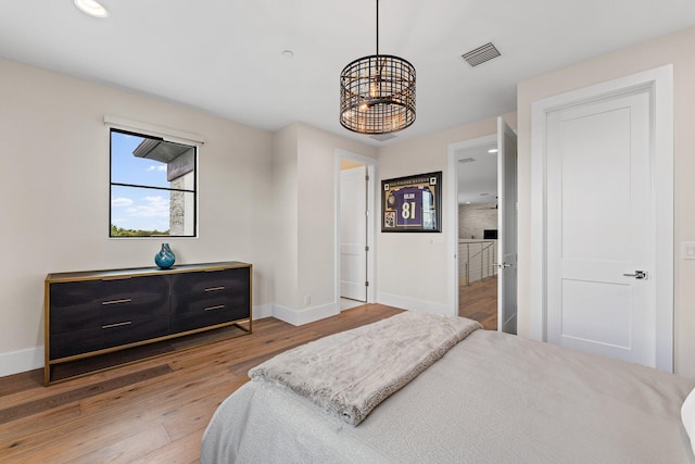 bedroom with hardwood / wood-style floors