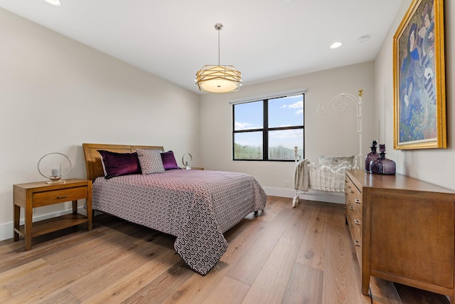 bedroom with light hardwood / wood-style floors