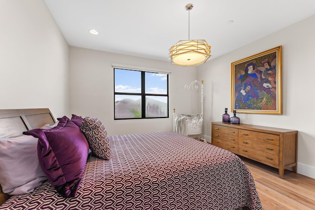 bedroom with light wood-type flooring