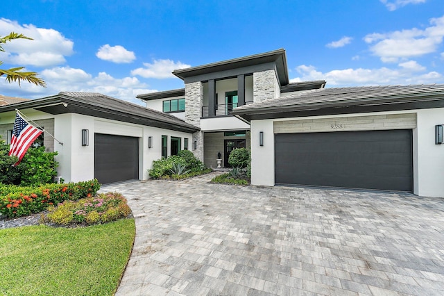 prairie-style home featuring a garage