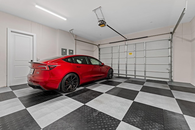 garage featuring a garage door opener and electric panel