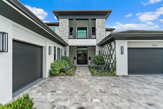 entrance to property with french doors and a garage