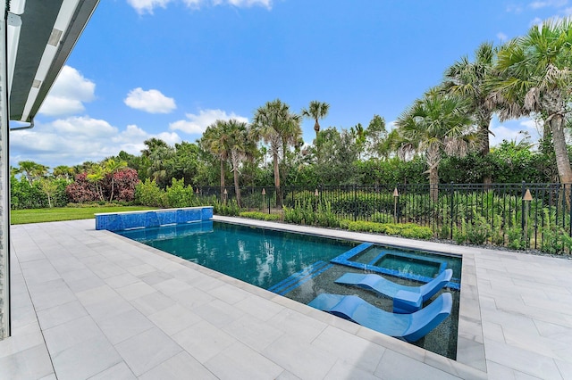 view of pool featuring an in ground hot tub and a patio