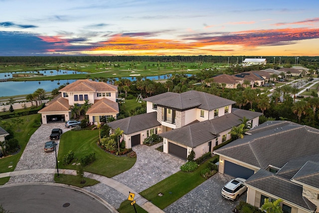 aerial view at dusk with a water view