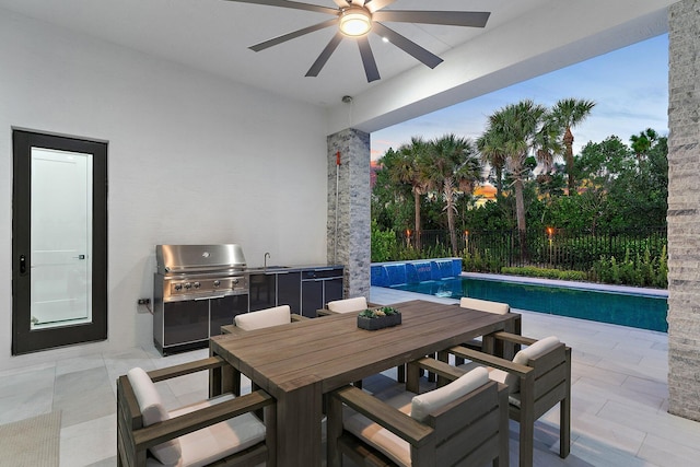 view of patio with ceiling fan, a fenced in pool, sink, and a grill