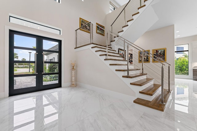 entrance foyer with french doors and a wealth of natural light