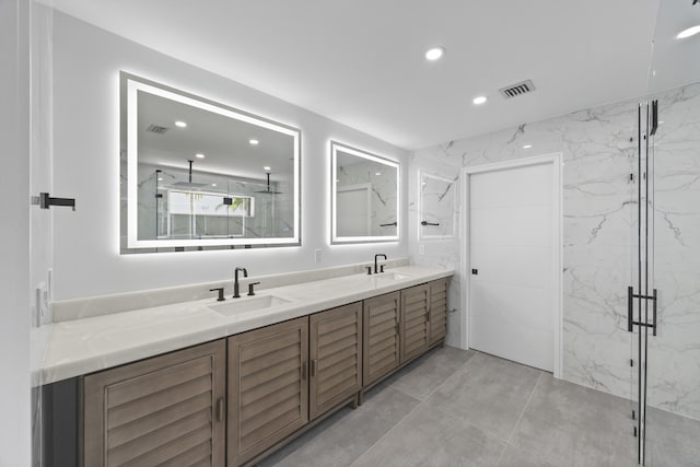 full bathroom with recessed lighting, double vanity, visible vents, and a sink