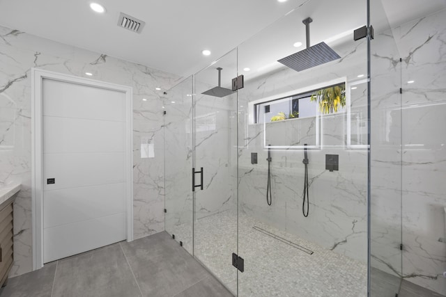 bathroom with visible vents, a marble finish shower, and recessed lighting
