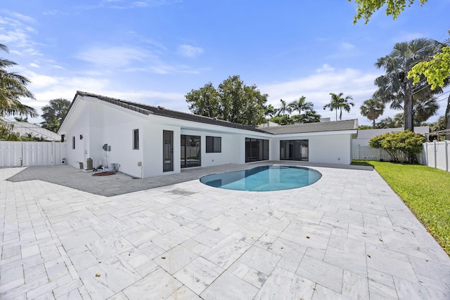 view of pool with a patio area, a fenced in pool, and a fenced backyard