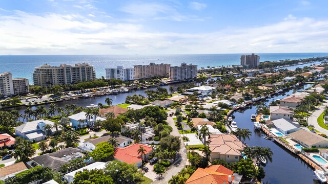 drone / aerial view featuring a residential view and a water view