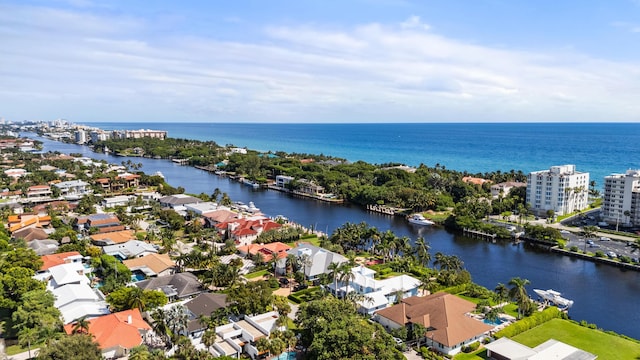 drone / aerial view featuring a water view and a residential view