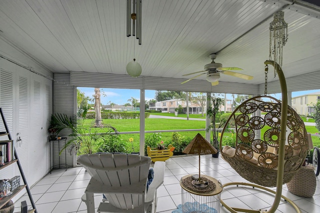 sunroom / solarium with ceiling fan and a wealth of natural light