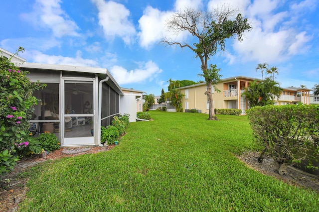 view of yard featuring a sunroom