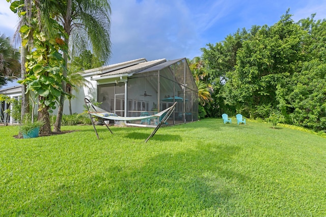 view of yard with ceiling fan