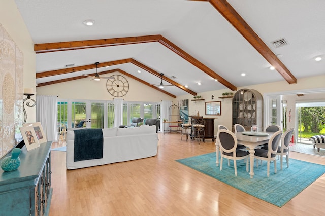 dining space featuring high vaulted ceiling, ceiling fan, light wood-type flooring, and beamed ceiling