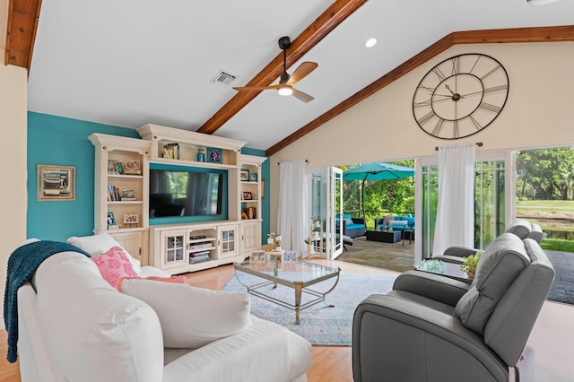 living room with high vaulted ceiling, light wood-type flooring, beam ceiling, and ceiling fan