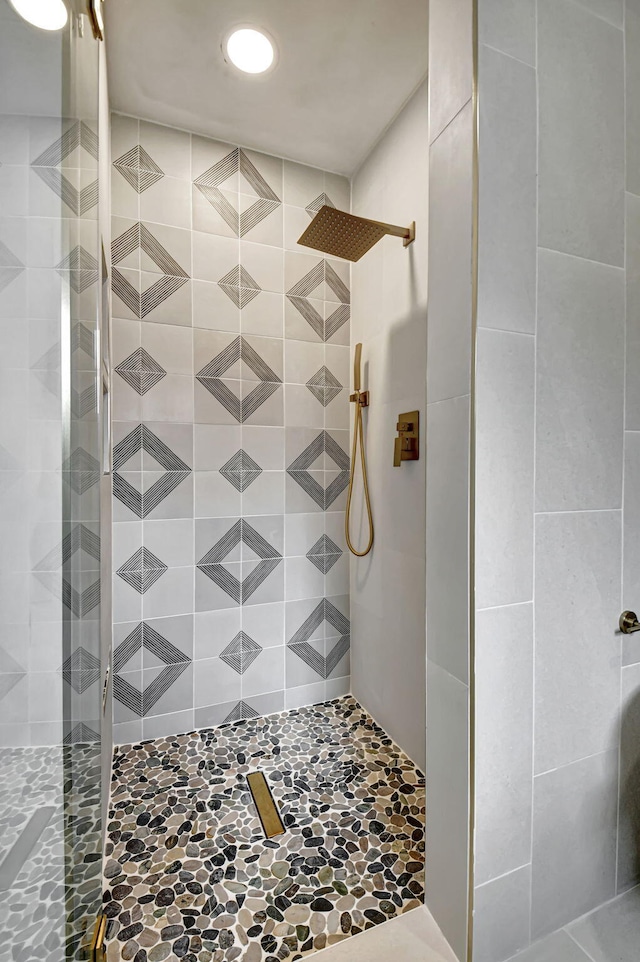 bathroom with tiled shower