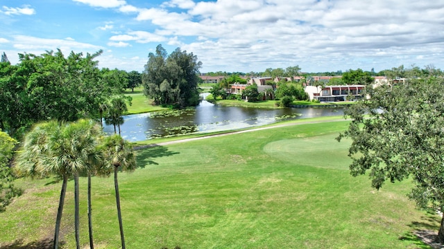 view of home's community featuring a yard and a water view