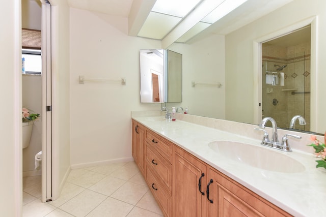 bathroom with vanity, a shower with shower door, toilet, and tile patterned flooring