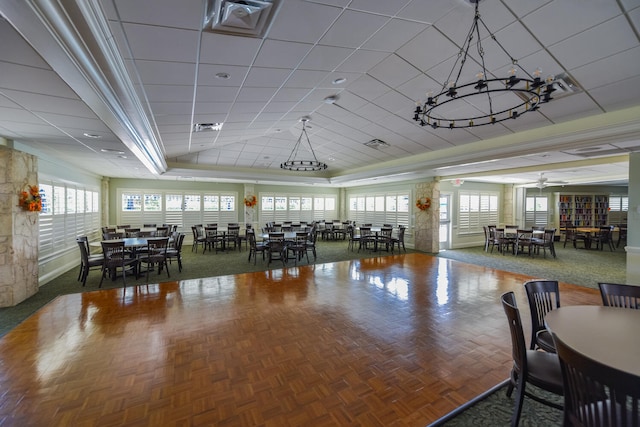 dining area featuring ornamental molding, ceiling fan, and parquet floors