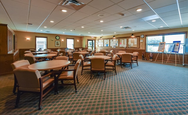 dining area with dark colored carpet