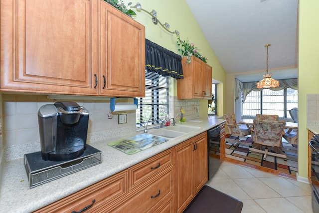 kitchen with black appliances, light tile patterned flooring, a healthy amount of sunlight, and sink