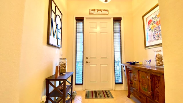 entrance foyer featuring light tile patterned floors