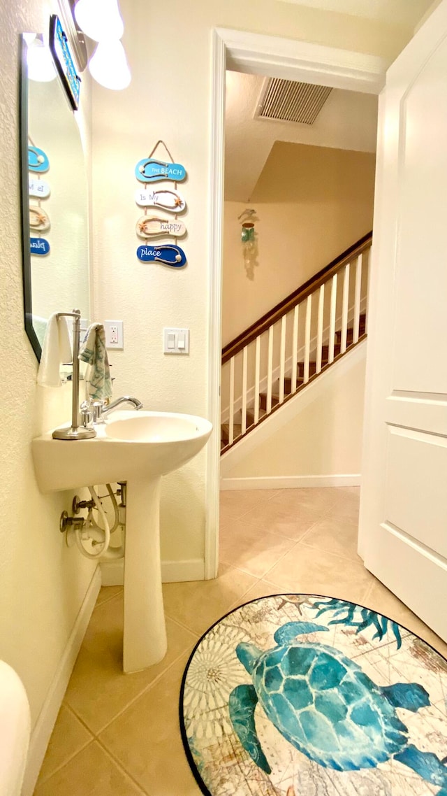 bathroom with tile patterned floors