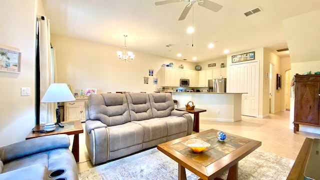 living room with ceiling fan with notable chandelier and light tile patterned flooring