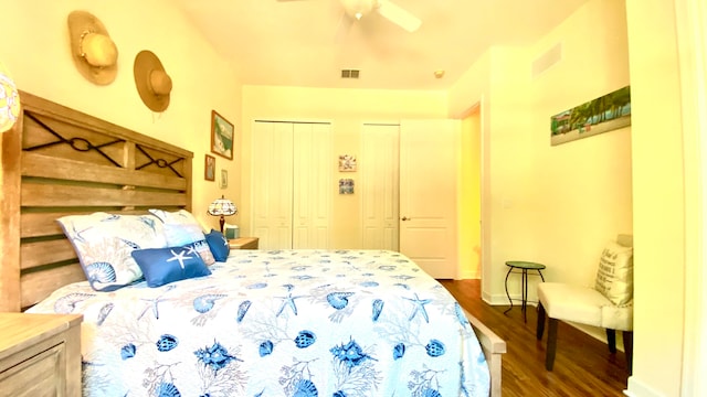 bedroom featuring dark hardwood / wood-style floors and ceiling fan