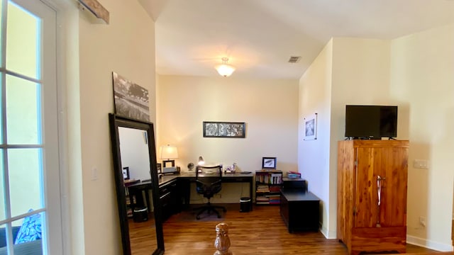 home office with wood-type flooring